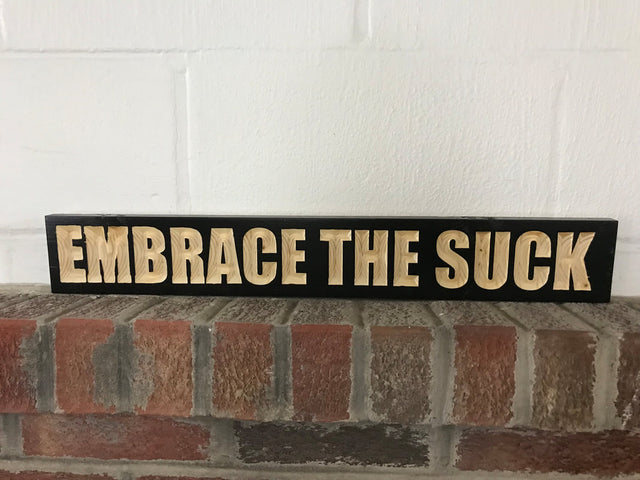 embrace the suck wooden sign